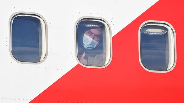Mask-wearing passenger