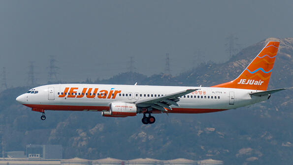 aircraft in flight over mountains