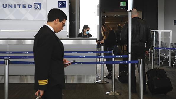 United Airlines gate with pilot