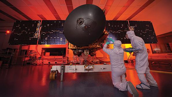 engineers working on spacecraft