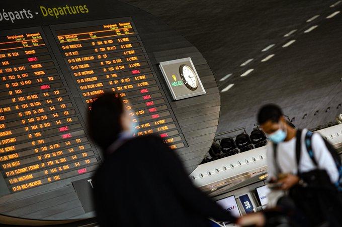 Paris airport travelers with masks
