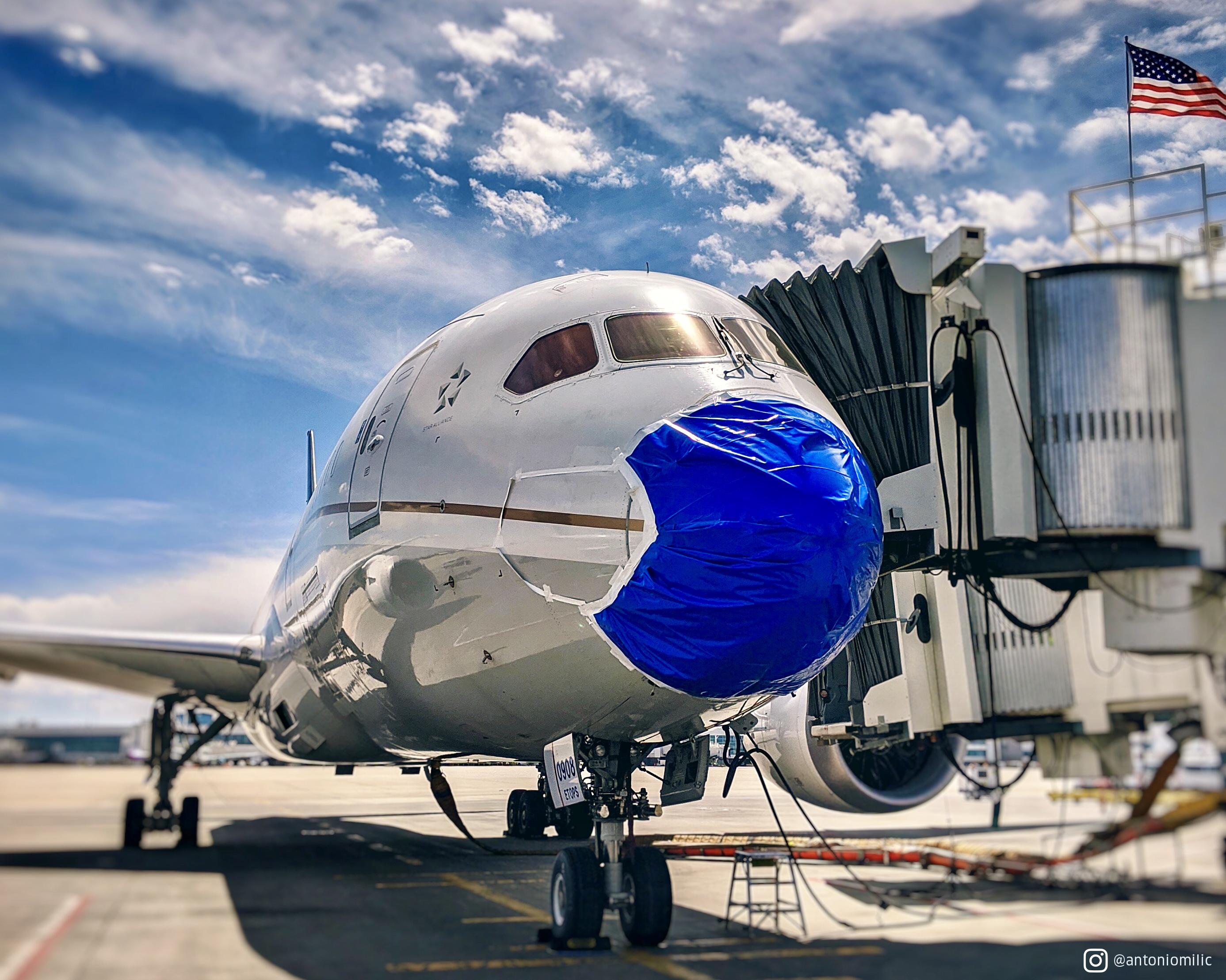 United Airlines plane with mask