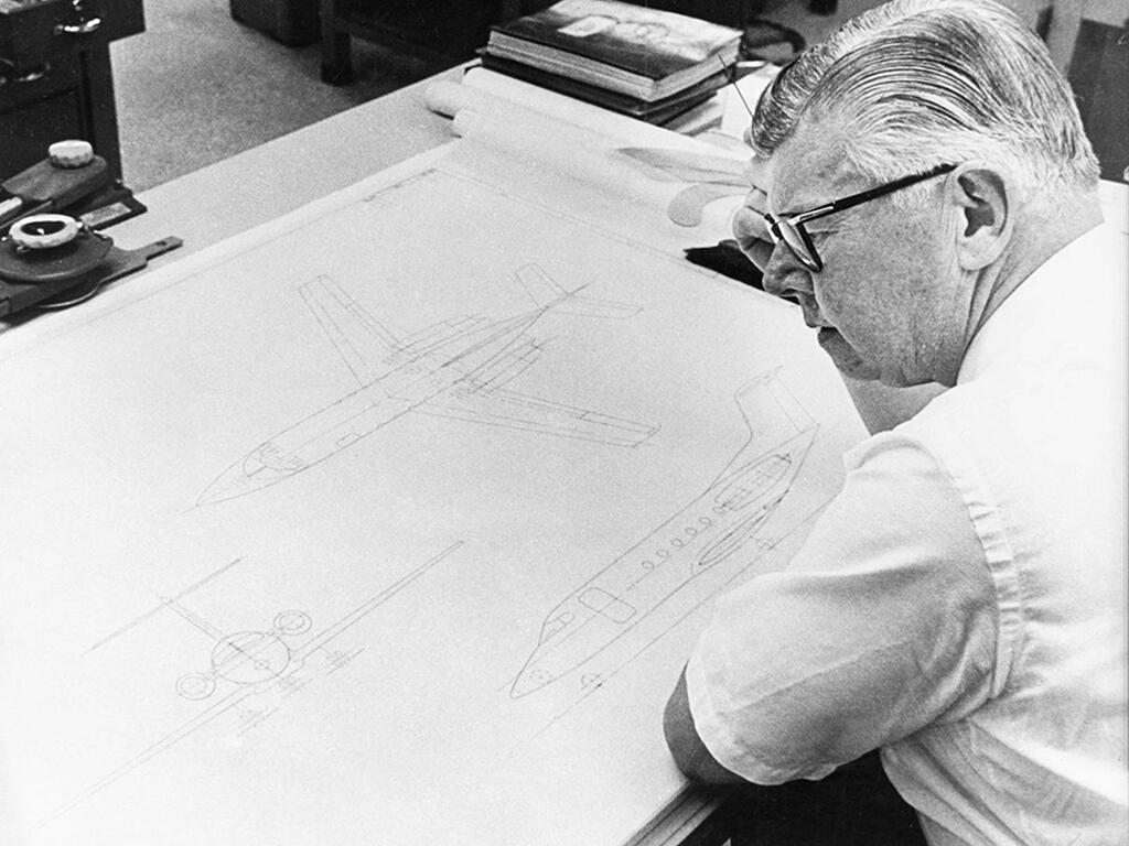 Learjet Bill Lear with blueprints