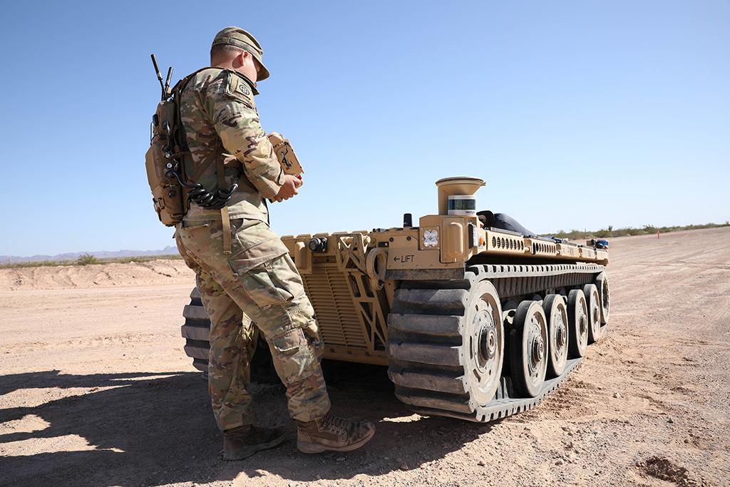 soldier using robotic controller of autonomous vehicle