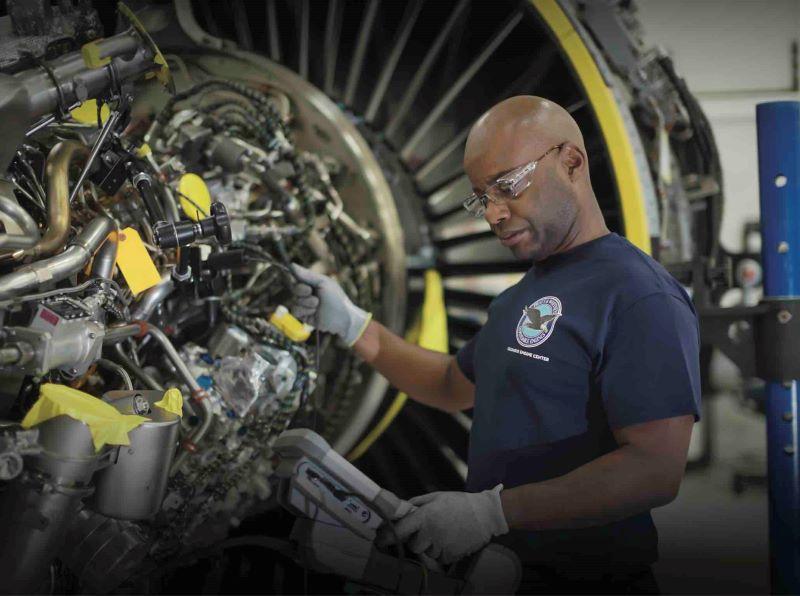 Mechanic working on jet engine