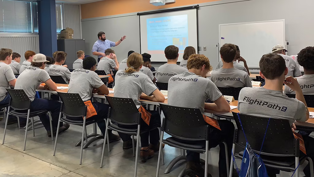 high school students studying aviation