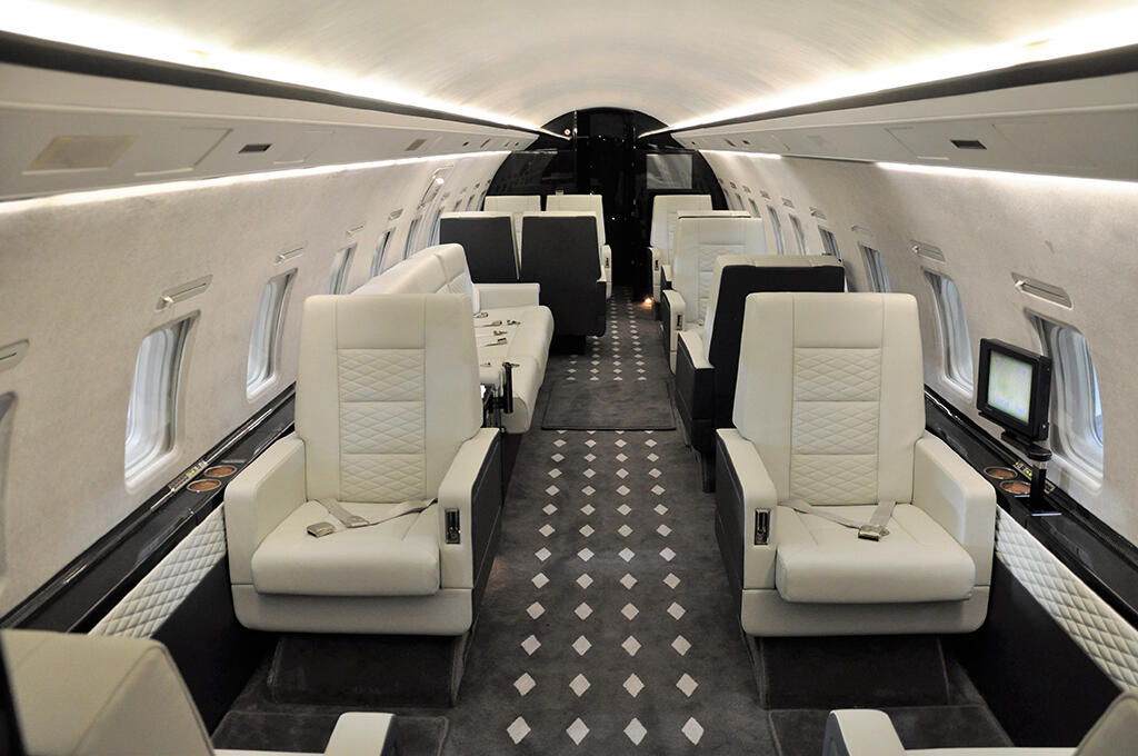 refurbished Challenger 850 interior showing new seating and matching diamond pattern carpeting