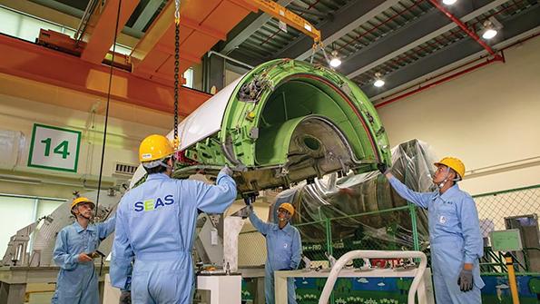 employees working on engine 