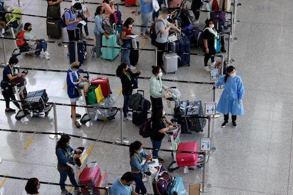 travelers waiting for COVID testing