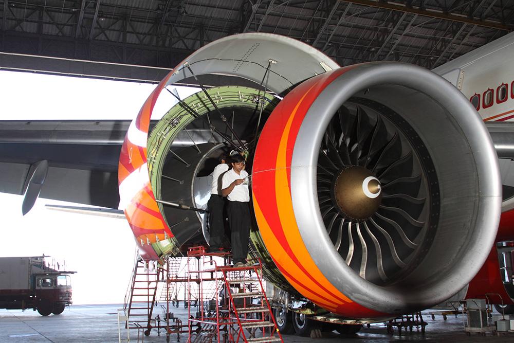 Technician works on an engine