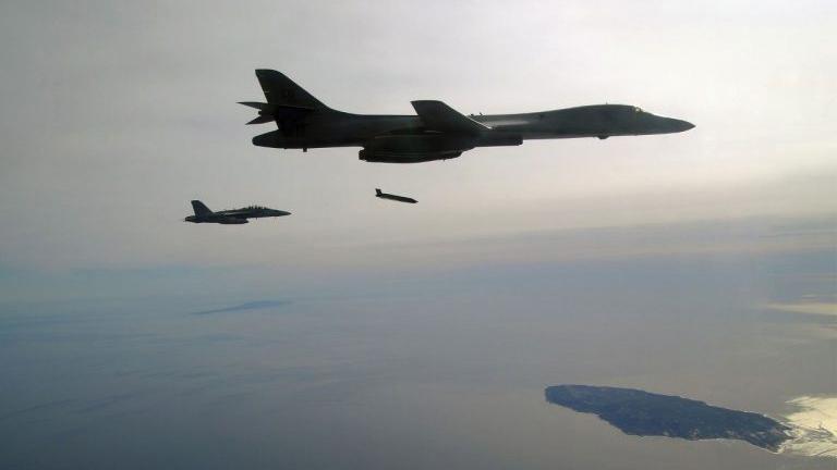 Naval aircraft releasing Long-Range Anti-Ship Missiles