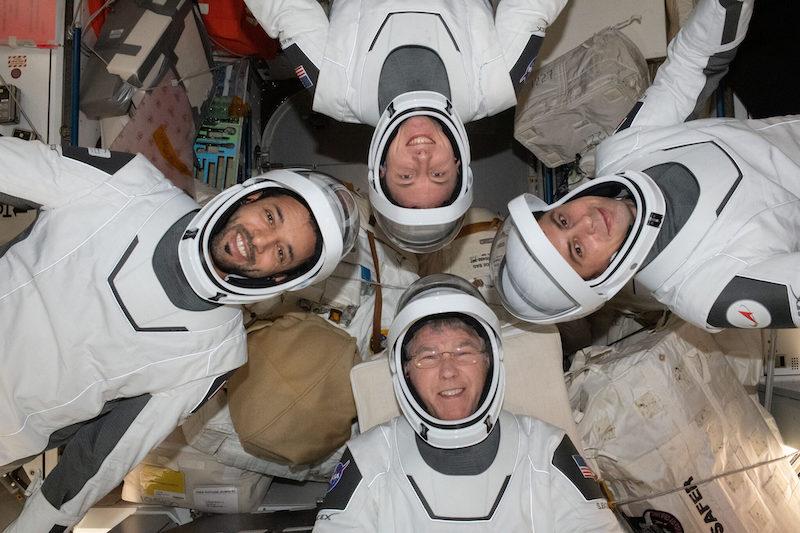 Four Expedition 69 flight engineers aboard the International Space Station