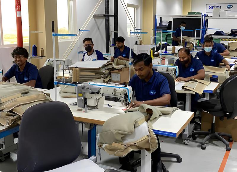 workers at Soisa Aircraft Interiors factory sewing