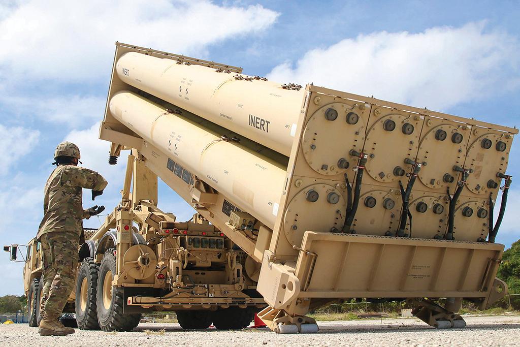 Soldier standing by THAAD system