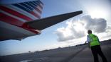 American Airlines pilot checking tail before flight