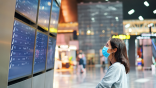 passenger looking at flight boards