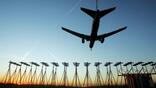Plane flying above Heathrow Airport