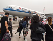 passengers boarding Air China aircraft